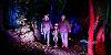 Family walking through the woods at Halloween Spooky Walk