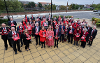 Stockton-on-Tees Borough Council councillors and officers wear red and hold posters to show their support for the Show Racism the Red Card campaign.