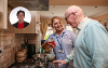 An image of a carer helping in a resident's kitchen. Image also has a headshot of Councillor Ann McCoy 