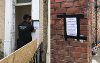 Two images of the closure order outside the property on Hartington Road
