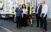 An image of the Bread and Butter Thing (TBBT) staff and volunteers stood outside a TBBT van. 