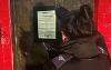 Civic Enforcement Officer displays closure order