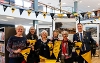 Mayor of Stockton-on-Tees holding flags with residents when visiting the Whistle Stop tour