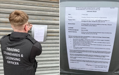Trading Standards Officer putting closure order on shutters of shop