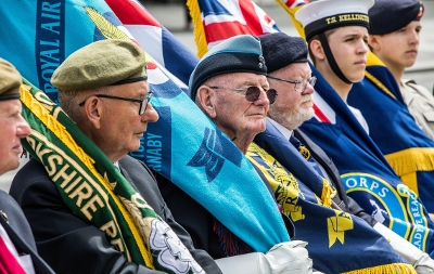 Photo of Armed Forces Day 2024 showing ex officers holding armed forces day flags
