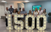 Employment and Training Hub staff standing around 1500 number lights 