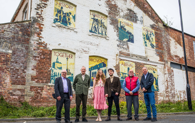Image of West Street Mural in Yarm to mark the bicentenary of the S&DR, as part of the S&DR200 Festival with Cllr Nigel Cooke and Reuben Kench  