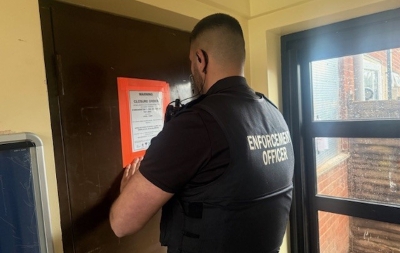 Image of enforcement officer issuing closure order of 8 Kirknewton Close, Hardwick in Stockton-on-Tees