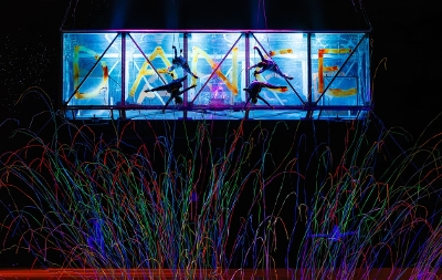 SIRF act with aerial acrobats and confetti below